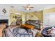 Inviting living room with fireplace, ceiling fan, and open view to the dining area at 3247 Mannington Dr, Charlotte, NC 28270