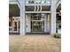 Modern building entrance with glass doors and sleek architectural design features at 333 W Trade St # 1106, Charlotte, NC 28202