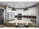 Bright kitchen with white cabinets, stainless steel appliances, and a stylish backsplash at 333 W Trade St # 1106, Charlotte, NC 28202