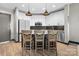 Well-lit kitchen with a central island, stainless appliances, and modern white cabinetry at 333 W Trade St # 1106, Charlotte, NC 28202