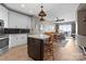Modern kitchen flows into a dining area, features stainless steel appliances and great lighting at 333 W Trade St # 1106, Charlotte, NC 28202