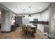 Open-concept kitchen with a large island, stainless appliances, and sleek white cabinetry at 333 W Trade St # 1106, Charlotte, NC 28202