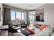 Comfortable living room with neutral tones, city views, and an entertainment area at 333 W Trade St # 1106, Charlotte, NC 28202