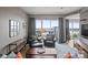 Cozy living room with comfortable seating and a balcony offering beautiful city views at 333 W Trade St # 1106, Charlotte, NC 28202
