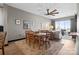 Comfortable living room featuring a ceiling fan, dining set and access to a balcony with city views at 333 W Trade St # 1106, Charlotte, NC 28202
