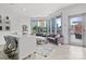 Open-concept living room with city views, stylish furniture, and access to a pool at 333 W Trade St # 1106, Charlotte, NC 28202