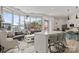 Bright and airy living room with floor to ceiling windows and eat in kitchen island at 333 W Trade St # 1106, Charlotte, NC 28202