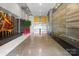 Spacious lobby area with modern art, plants, and marble flooring and interesting design elements at 333 W Trade St # 1106, Charlotte, NC 28202