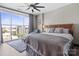 Bright main bedroom with a large window and light-blocking curtains, plus a chaise lounge at 333 W Trade St # 1106, Charlotte, NC 28202