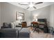 Well-lit office space with a desk, monitors, office chair, and a comfortable gray arm chair at 333 W Trade St # 1106, Charlotte, NC 28202