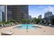 Relax and enjoy the rooftop pool with surrounding deck and lounge chairs at 333 W Trade St # 1106, Charlotte, NC 28202