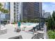 Take a swim in the condo rooftop pool and deck area with lounge chairs at 333 W Trade St # 1106, Charlotte, NC 28202