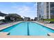 Enjoy lounging by the rooftop pool at this condo with lounge chairs, tables and umbrellas at 333 W Trade St # 1106, Charlotte, NC 28202