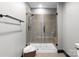 Glass-enclosed shower featuring tile walls, a rainfall shower head, and a built-in shower seat at 333 W Trade St # 1106, Charlotte, NC 28202