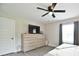 Relaxing bedroom with bright natural light, stylish dresser, and modern ceiling fan at 339 Brown Rd, China Grove, NC 28023