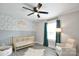 Cozy Bedroom with decorative wallpaper, stylish light fixtures, and a comfortable chair at 339 Brown Rd, China Grove, NC 28023