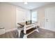 Bright dining room with a modern table, bench seating, and neutral wall paint at 339 Brown Rd, China Grove, NC 28023