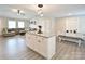 Open-concept kitchen with an island that flows into the dining and living areas at 339 Brown Rd, China Grove, NC 28023