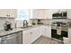 Well-lit kitchen featuring stainless steel appliances, granite countertops, and white subway tile backsplash at 339 Brown Rd, China Grove, NC 28023