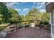 Wide angle shot of a backyard featuring a spacious deck overlooking a pool, gazebo, and lush greenery at 3500 Cedar Springs Sw Dr, Concord, NC 28027