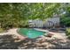Lush backyard with a large in-ground pool, gazebo, patio area, and manicured landscaping at 3500 Cedar Springs Sw Dr, Concord, NC 28027