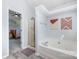 This bathroom has a glass enclosed shower and a soaking tub at 3500 Cedar Springs Sw Dr, Concord, NC 28027