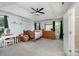 Comfortable bedroom with carpet, ceiling fan, and natural light at 3500 Cedar Springs Sw Dr, Concord, NC 28027