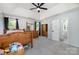 This bedroom features carpet, ceiling fan, natural light, and ensuite access at 3500 Cedar Springs Sw Dr, Concord, NC 28027