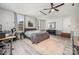 This bedroom boasts ample space, wood floors, and a modern aesthetic at 3500 Cedar Springs Sw Dr, Concord, NC 28027