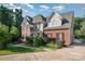A spacious home featuring brick and siding, a large yard, and a well-manicured lawn at 3500 Cedar Springs Sw Dr, Concord, NC 28027