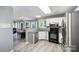 Cozy kitchen featuring stainless steel appliances, and a view into the dining and living areas at 3500 Cedar Springs Sw Dr, Concord, NC 28027