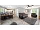 View of the living room and kitchen area in neutral colors, with hardwood flooring at 3500 Cedar Springs Sw Dr, Concord, NC 28027
