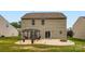 Backyard patio with a pergola, outdoor seating, and grassy area at 4151 Granite St, Midland, NC 28107