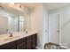 Bathroom featuring a double sink vanity, large mirror, and contemporary finishes at 4151 Granite St, Midland, NC 28107