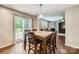 Dining area with hardwood floors, patio access, and a view into the bright and open living room at 4151 Granite St, Midland, NC 28107