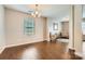 Bright dining area with hardwood floors and a modern chandelier, perfect for entertaining at 4151 Granite St, Midland, NC 28107