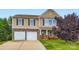 Charming two-story home with a manicured lawn and a two-car garage showcasing great curb appeal at 4151 Granite St, Midland, NC 28107