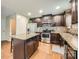 Well-equipped kitchen featuring an island, stainless steel appliances, and wood-look floors at 4151 Granite St, Midland, NC 28107