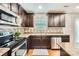 The beautiful kitchen boasts stainless steel appliances, a tiled backsplash, and ample cabinet space at 4151 Granite St, Midland, NC 28107