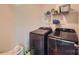 A functional laundry room complete with a modern washer, dryer, and storage shelves at 4151 Granite St, Midland, NC 28107