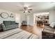 Inviting living room with an open layout showcasing hardwood floors, a fireplace, and kitchen access at 4151 Granite St, Midland, NC 28107