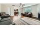 Open-concept living room featuring hardwood floors, a fireplace, and a view into the kitchen at 4151 Granite St, Midland, NC 28107