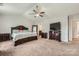Spacious main bedroom suite with a ceiling fan, neutral carpet, and a well-appointed design at 4151 Granite St, Midland, NC 28107