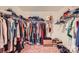 Walk-in closet with extensive shelving and hanging storage for ample organization at 4151 Granite St, Midland, NC 28107