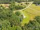 Ariel view of the property showing the surrounding trees, driveway and surrounding houses at 4330 Rowell Rd, Lancaster, SC 29720
