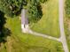 Aerial perspective of the property featuring a lush green lawn, house, and long driveway at 4330 Rowell Rd, Lancaster, SC 29720