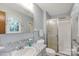 Bathroom features a shower and a window to the outside. Toilet sits next to the vanity at 4330 Rowell Rd, Lancaster, SC 29720