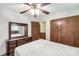Bedroom featuring a large dresser with a mirror and two closets with wooden doors at 4330 Rowell Rd, Lancaster, SC 29720