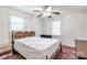 Spacious bedroom with two windows, a ceiling fan, and a dark wooden bedroom set at 4330 Rowell Rd, Lancaster, SC 29720