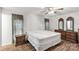 Cozy bedroom with two windows, a ceiling fan, and a classic wooden furniture set at 4330 Rowell Rd, Lancaster, SC 29720